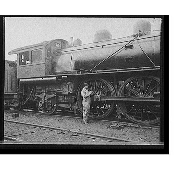 Historic Print, [Railroad engineer oiling up before the start], 16" x 20"