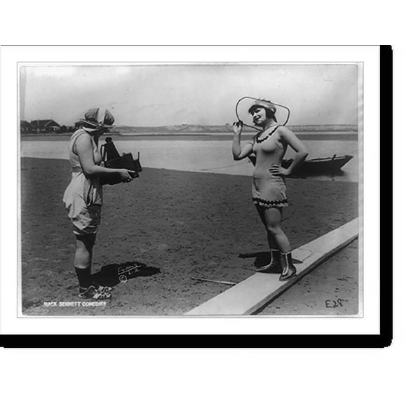 Historic Print, [Roxy McGowan and Mary Thurman in bathing suits, with one taking the other's picture on beach, posed for Mack Sennett Productions].Evans Studio, L.A., 18" x 24"