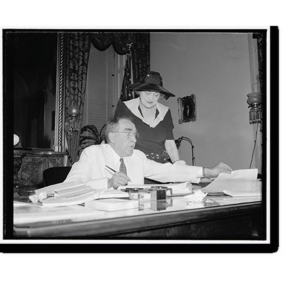 Historic Print, Speaker signs last minute bills. Washington, D.C., June 15. With Mrs. Bankhead looking on, Speaker of the House William B. Bankhead is pictured signing last-minute bills...18" x 24"