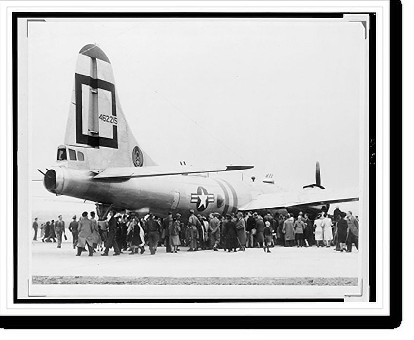 Historic Print, The B29 superfort is the center of interest of a group
