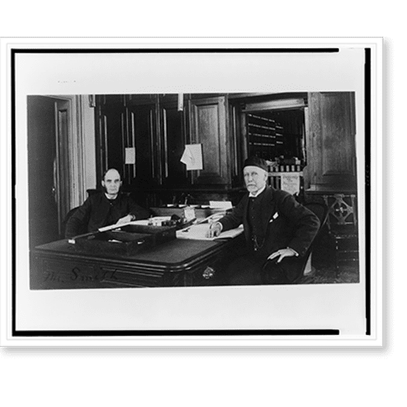 Historic Print, [Two Treasury Department employees seated at desk in office], 16" x 20"
