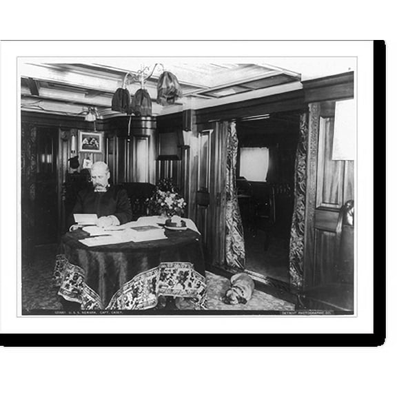 Historic Print, U.S.S. NEWARK. Capt. Casey [seated at table reading; dog lying on rug], 18" x 24"