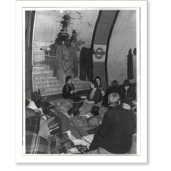 Historic Print, [West End London shelter. In a tube station converted to a shelter a huge government poster decorates the wall...below sitting where the tracks used to be, are the shelt…16" x 20"