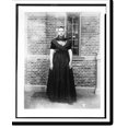 Historic Print, [Woman in traditional Dutch dress in front of Cacao van