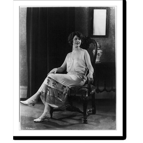 Historic Print, [Woman modeling clothing: Satin of shell pink colour is trimmed with crystal fringe...make up this gown, which is also enhanced by amethist drops; It is sponsored by Mau...18" x 24"