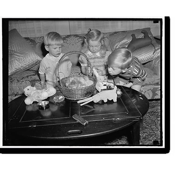 Historic Print, Woodring children get preview of their Easter Basket. Washington, D.C., April 5. The Woodring children, sons and daughter of the Secretary of War and Mrs. Harry H., 16" x 20"
