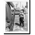Historic Print, [Young Japanese boy standing beside rifle held by