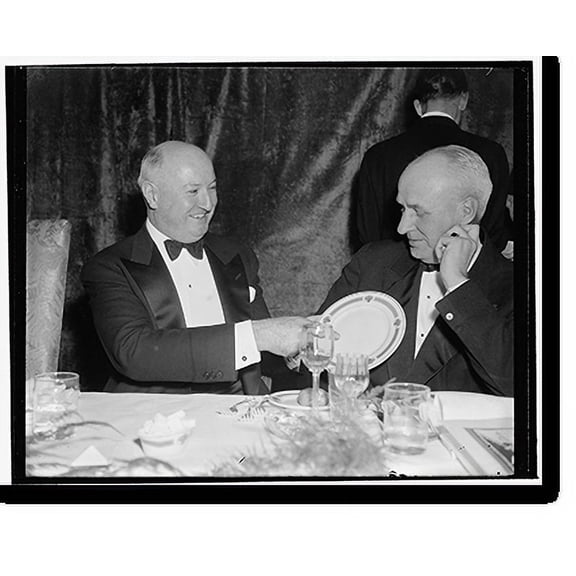 Historic Print, Here it is: price $100. Washington, D.C., Jan. 7. 'This' says Postmaster General James A. Farley, 'is the $100 Jackson Day Dinner plate.' O. Max Gardiner, former Governo...18" x 24"