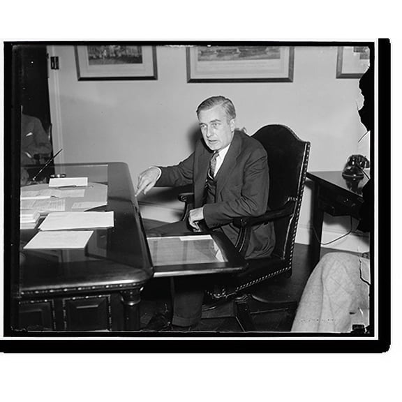 Historic Print, On job. Washington, D.C. Jan. 19. Charles Edison, son of the famous inventor and new Assistant Secretary of the Navy, pictured at his desk today. He was inducted into of16" x 20"