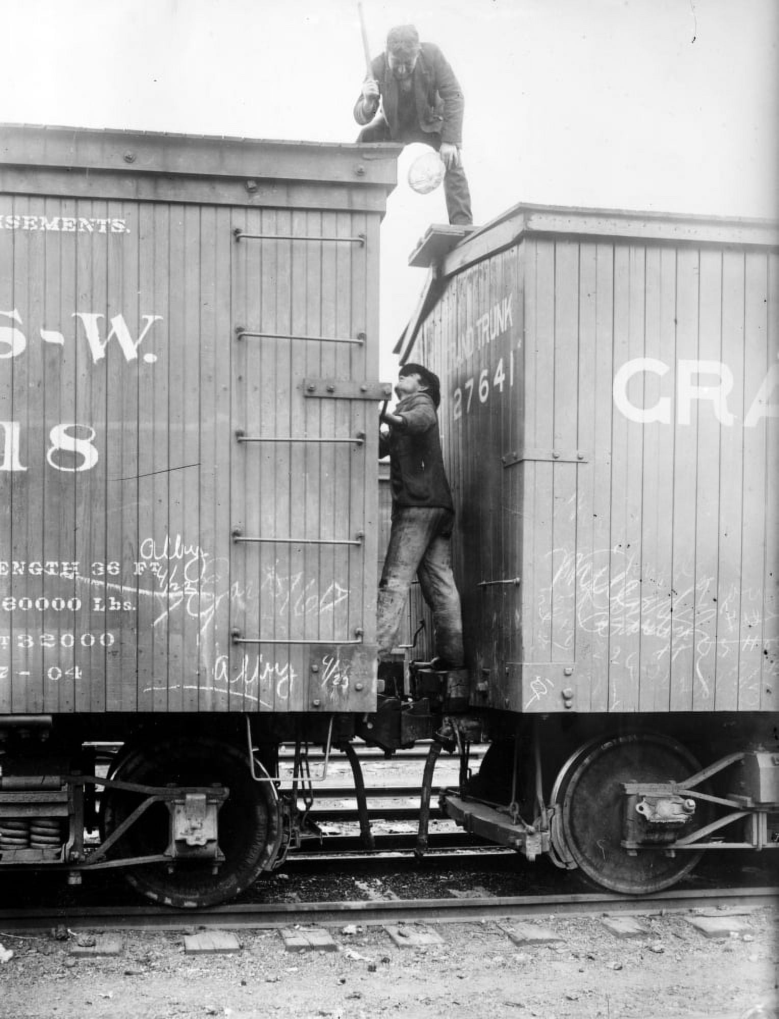 Hobos, C1915. /Nhoboes Fighting Between Railroad Cars. Photograph