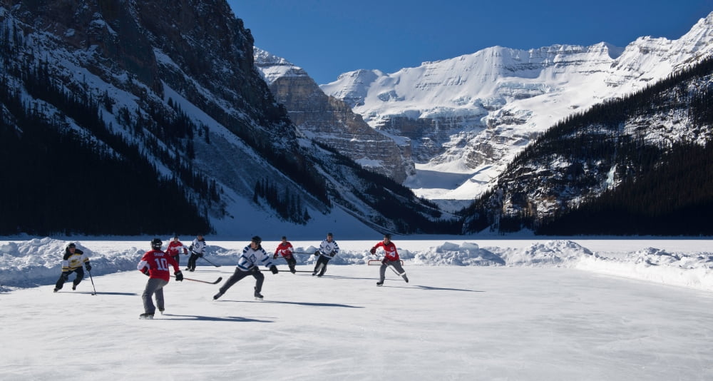 Hockey players playing on the frozen Lake Louise Mount Victoria Banff National Park Alberta Canada Canvas Art - Panoramic Images (12 x 24)