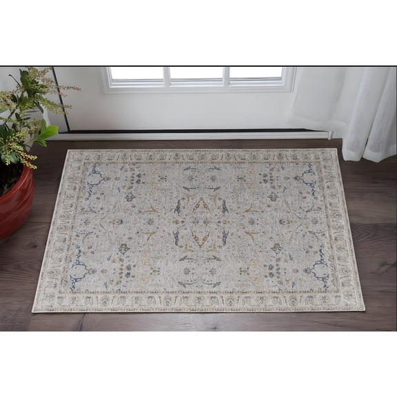 HomeRoots 567570 2 x 3 ft. Ikat Power Loom Worn Faded Rectangle Area Rug with Fringe, Ivory, Taupe & Blue