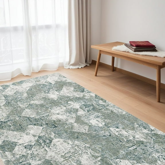 5' X 8' Green And Ivory Patchwork Distressed Stain Resistant Area Rug