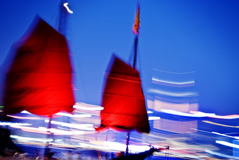 Hong Kong Tsim Sha Tsui K A Red Sailed Chinese Junk Boat Passes In Front Of Hong Kong Island Canvas Art - Ray Laskowitz Design Pics (17 x 11)