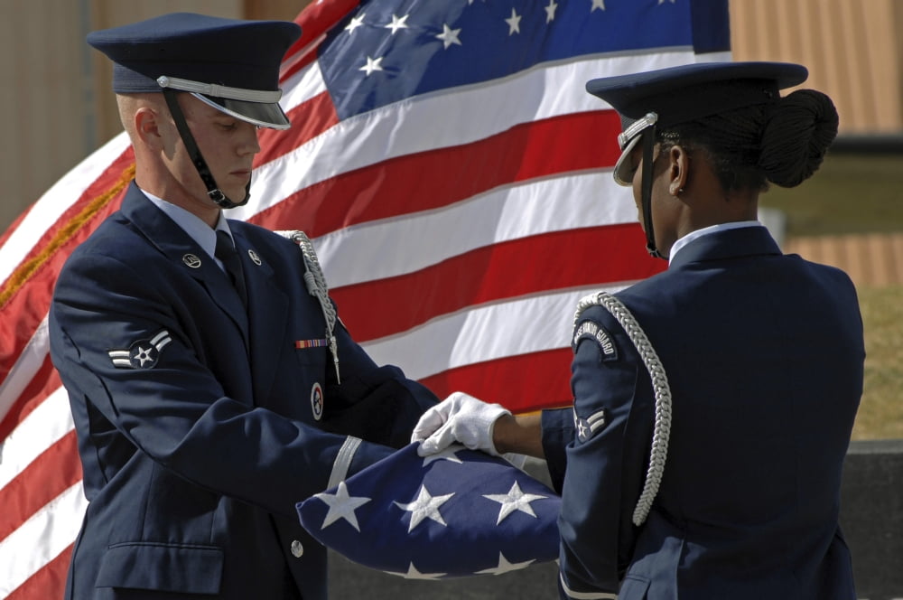 Honor guard members fold the American Flag during a 911 memorial Canvas Art - Stocktrek Images (34 x 23)