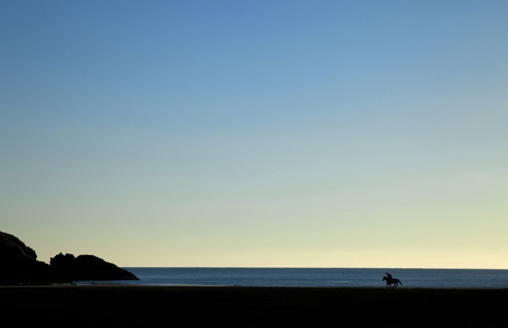 Horse and Rider on Stradbally Beach County Waterford Ireland Canvas Art - Panoramic Images (36 x 24)