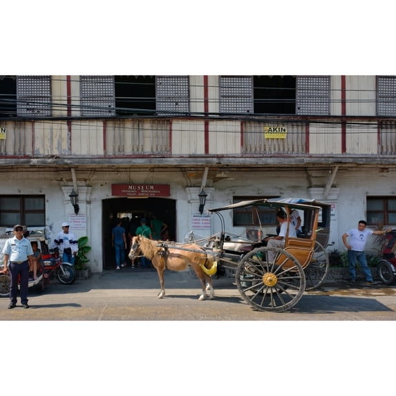 Horsedrawn and people outside a museum Crisologo Museum Vigan Ilocos Sur Philippines Print by Panoramic Images