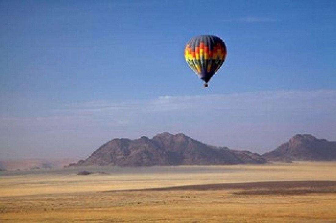 Hot air balloon over Namib Desert Africa Canvas Art - David Wall DanitaDelimont (19 x 12)