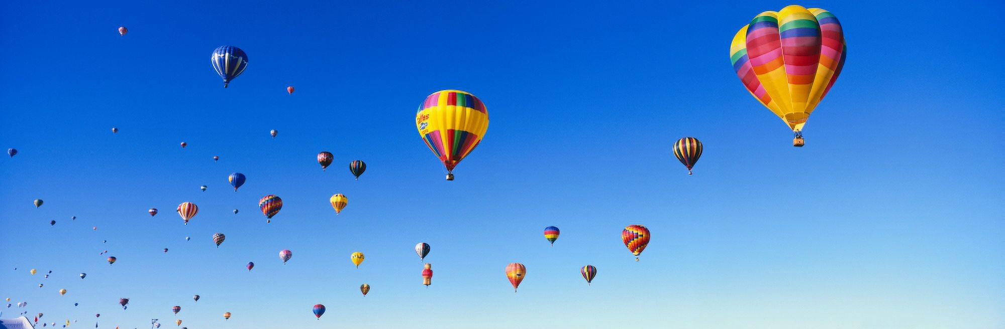 Hot air balloons floating in sky Canvas Art - Panoramic Images (27 x 9)