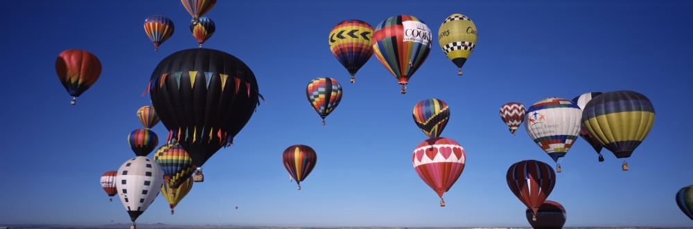 Hot air balloons floating in sky Albuquerque International Balloon Fiesta Albuquerque Bernalillo County New Mexico USA Canvas Art - Panoramic Images (36 x 12)