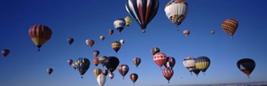 Hot air balloons floating in sky Albuquerque International Balloon Fiesta Albuquerque Bernalillo County New Mexico USA Canvas Art - Panoramic Images (36 x 12)