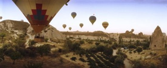 Hot air balloons over landscape at sunrise Cappadocia Central Anatolia Region Turkey Canvas Art - Panoramic Images (30 x 13)