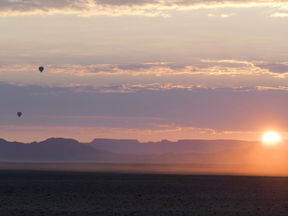 Hot air balloons rising above desert at dusk Namib-Naukluft National Park Hardap Namibia Canvas Art - Panoramic Images (12 x 16)