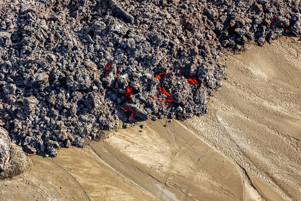 Hot lava creeping by tire tracks Eruption site at Holuhraun near Bardarbunga Volcano Iceland Canvas Art - Panoramic Images (36 x 12)