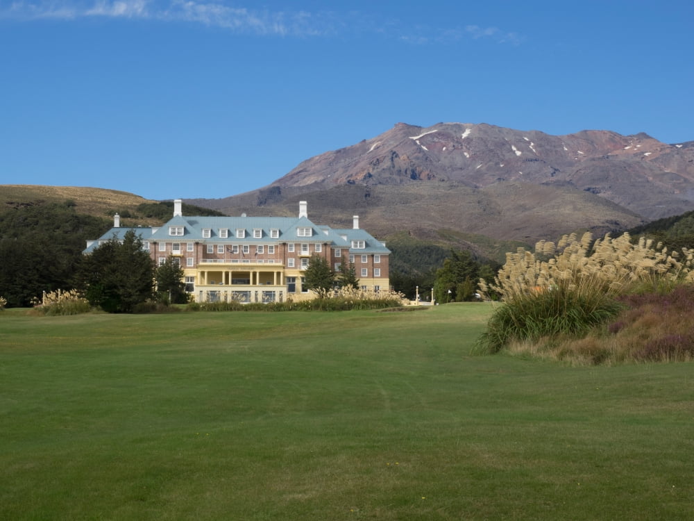 Hotel with mountain range in the background Chateau Tongariro Tongariro National Park Ruapehu North Island New Zealand Canvas Art - Panoramic Images (24 x 36)