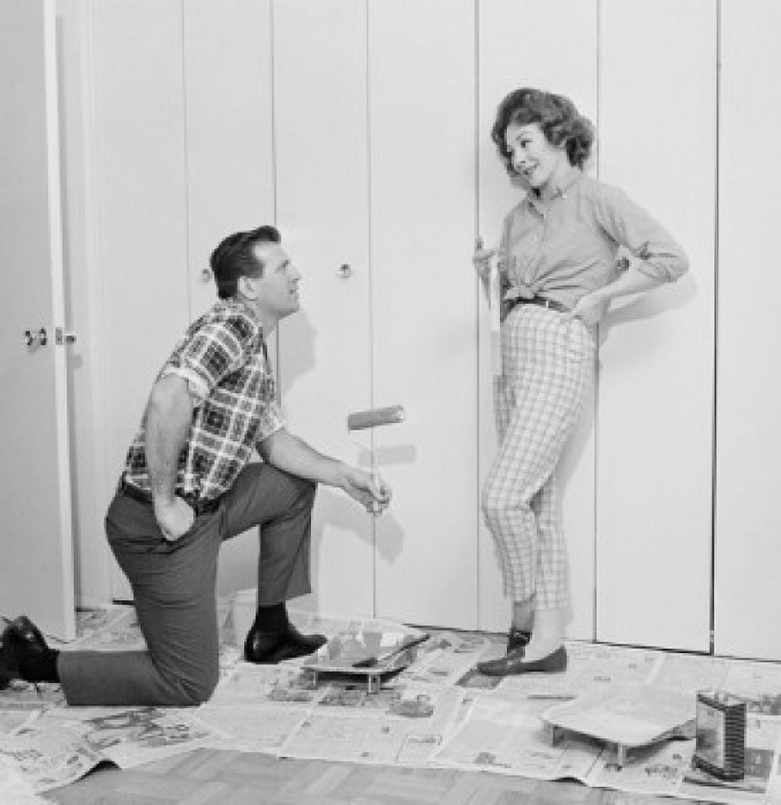 House husband painting closet door while housewife is watching Canvas Art - (18 x 24)