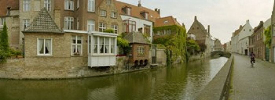 Houses along a channel Bruges West Flanders Belgium Canvas Art - Panoramic Images (18 x 7)