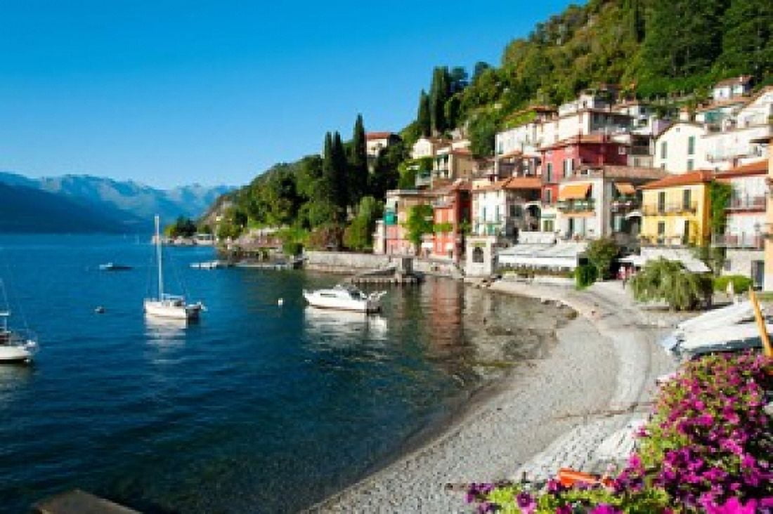 Houses at waterfront with boats on Lake Como Varenna Lombardy Italy Canvas Art - Panoramic Images (36 x 24)