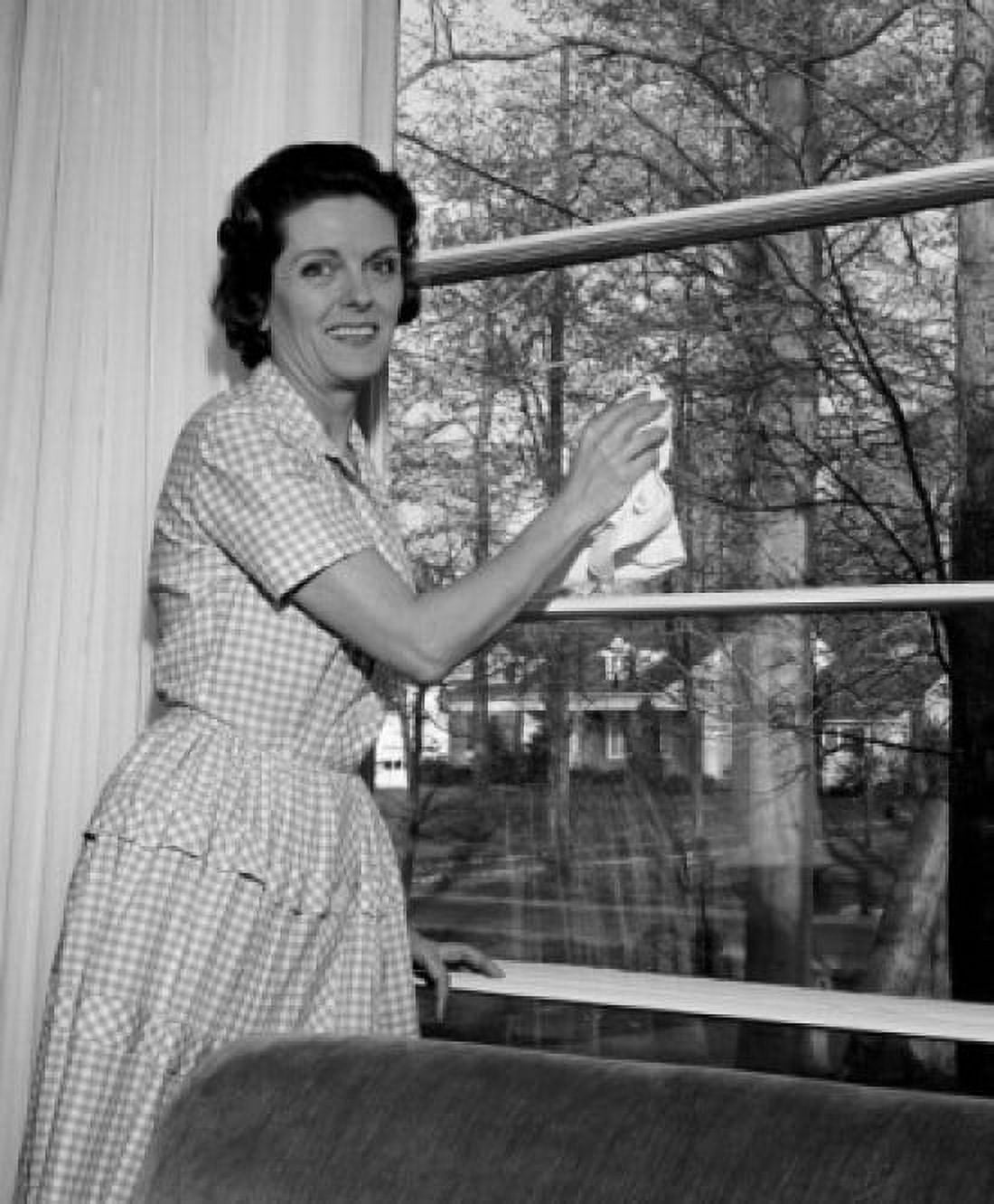 Housewife cleaning window Canvas Art - (24 x 36)