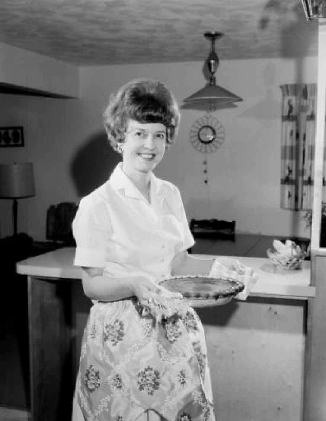 Housewife holding pie and smiling Canvas Art - (18 x 24)
