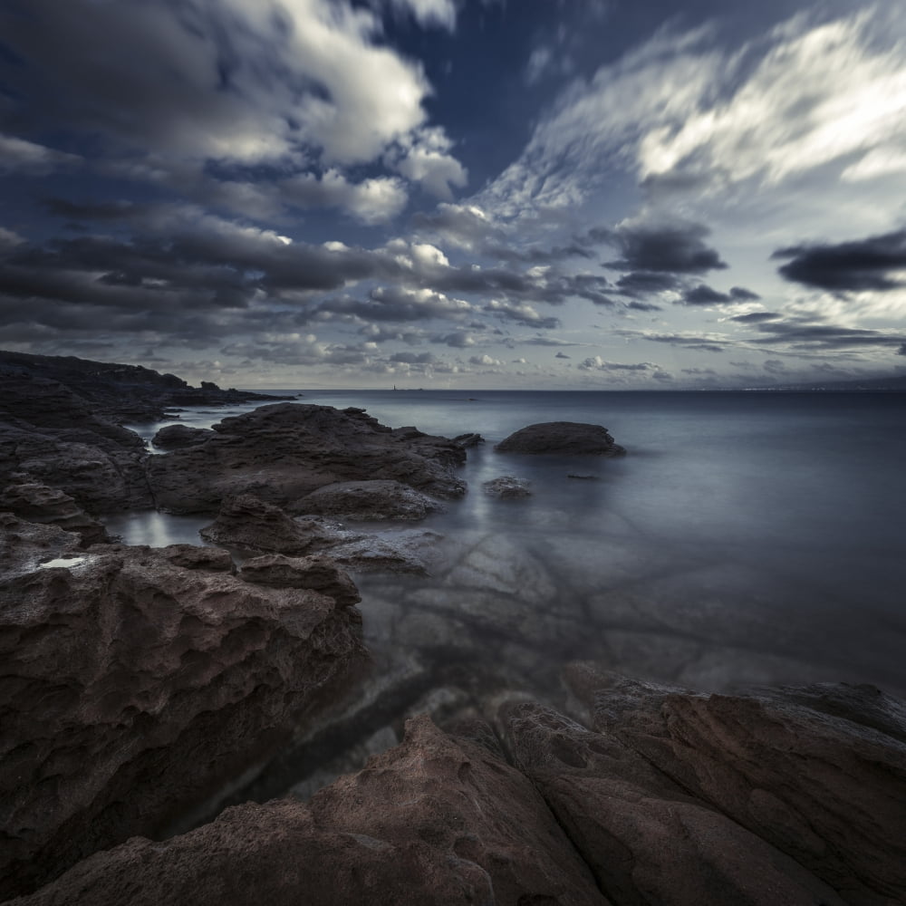 Huge rocks on the shore of a sea against a cloudy sky Sardinia Italy Canvas Art - Evgeny KuklevStocktrek Images (29 x 29)