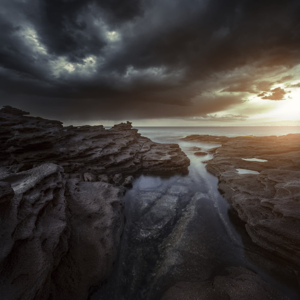 Huge rocks on the shore of a sea against stormy clouds Sardinia Italy Canvas Art - Evgeny KuklevStocktrek Images (29 x 29)