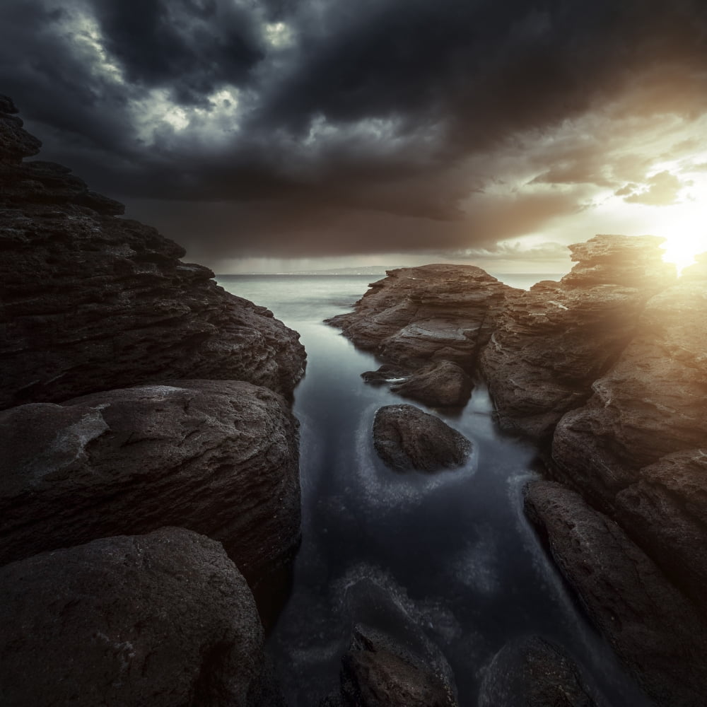 Huge rocks on the shore of a sea against stormy clouds Sardinia Italy Canvas Art - Evgeny KuklevStocktrek Images (29 x 29)