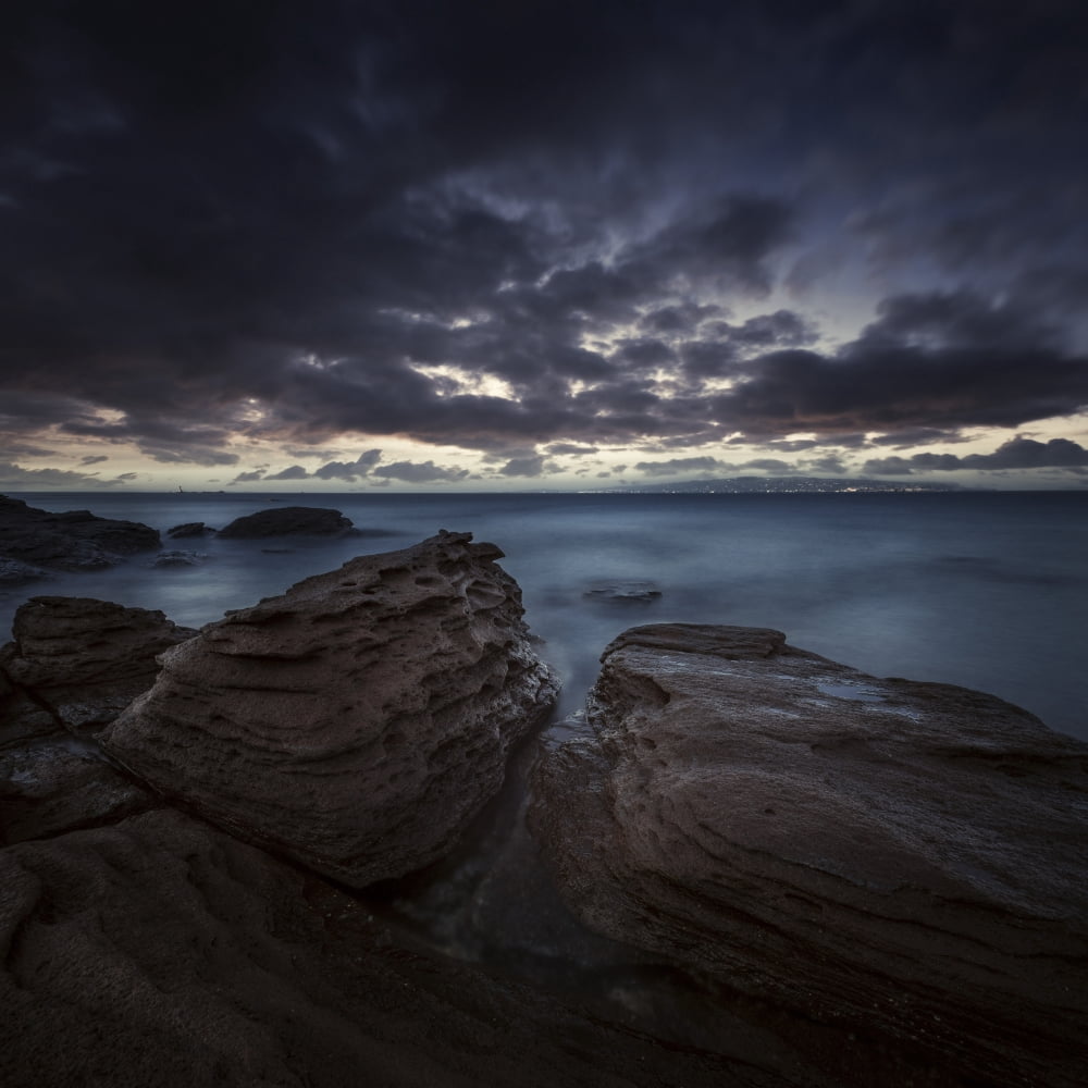 Huge rocks on the shore of a sea against stormy clouds Sardinia Italy Canvas Art - Evgeny KuklevStocktrek Images (29 x 29)