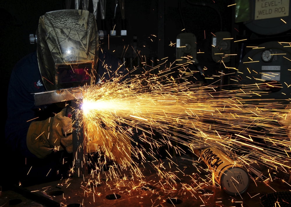Hull Maintenance Technician welds scrap metal Canvas Art - Stocktrek Images (34 x 24)