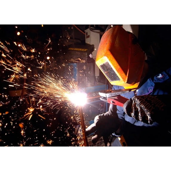 Hull Technician practices cutting metal using a Carbon arc Poster Print by Stocktrek Images (34 x 22)