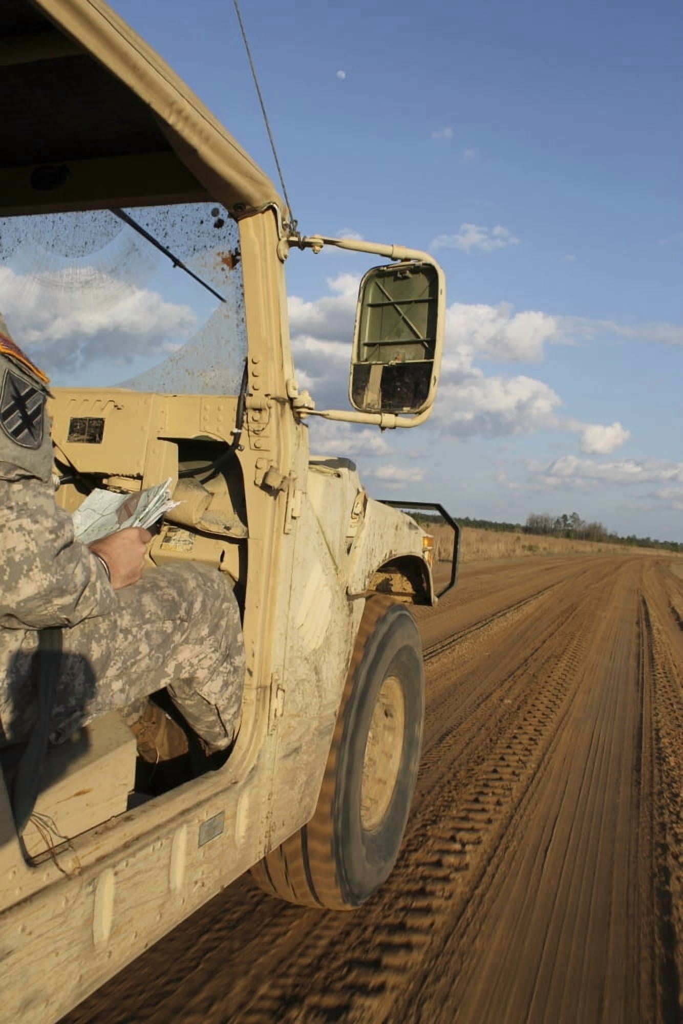 Humvee driving down a dirt road in Honduras Canvas Art - Stocktrek Images (23 x 34)