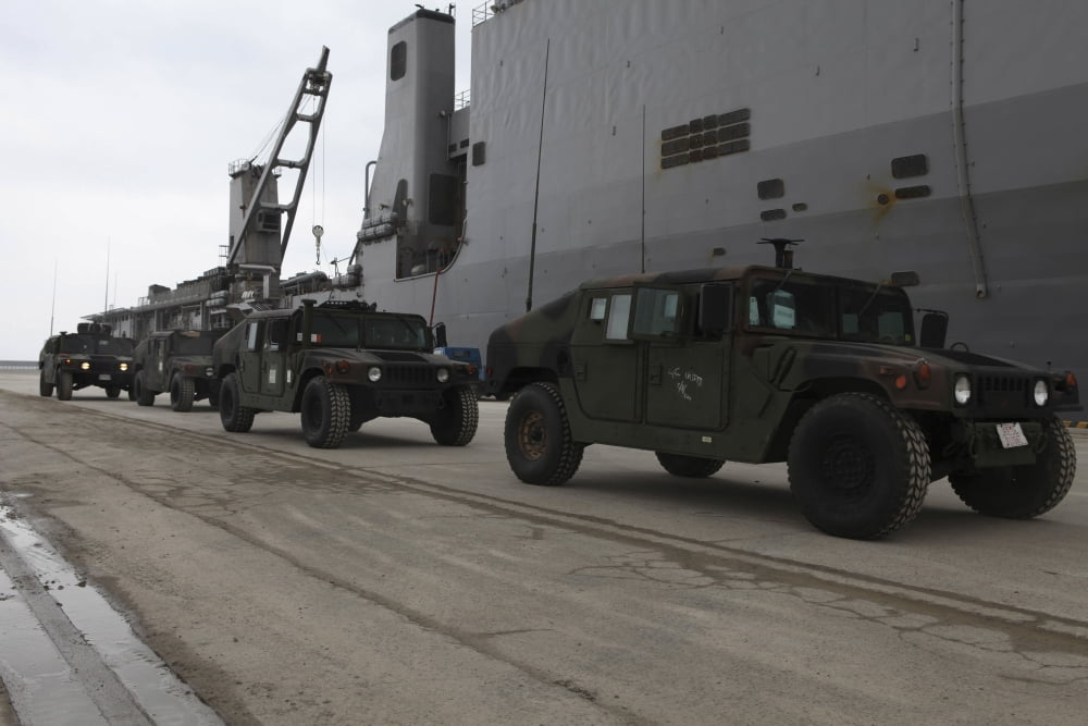 Humvees depart USS Harpers Ferry in support of Operation Tomodachi Canvas Art - Stocktrek Images (34 x 23)