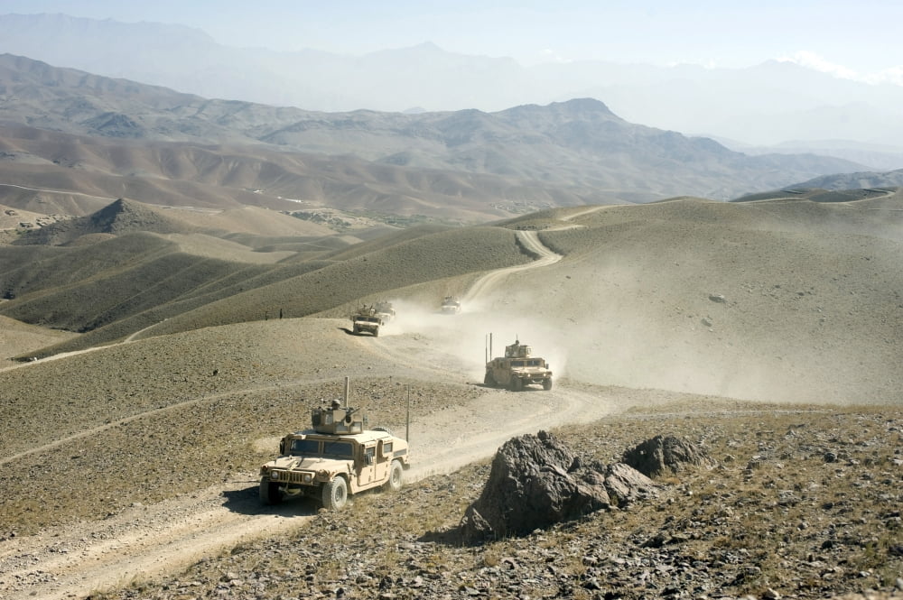 Humvees traverse rugged mountain roads Canvas Art - Stocktrek Images (34 x 23)