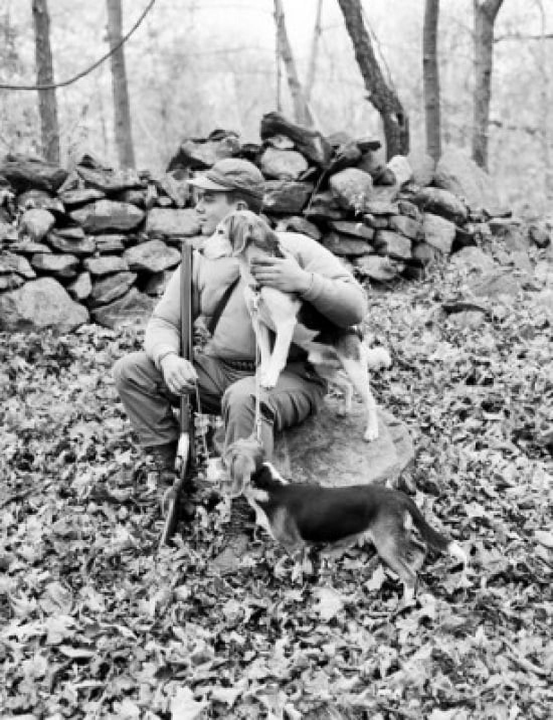 Hunter with dogs sitting on stump in forest Canvas Art - (24 x 36)