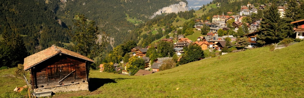 Hut with village in the background Wengen Lauterbrunnen Interlaken-Oberhasli Bernese Oberland Bern Switzerland Canvas Art - Panoramic Images (36 x 12)