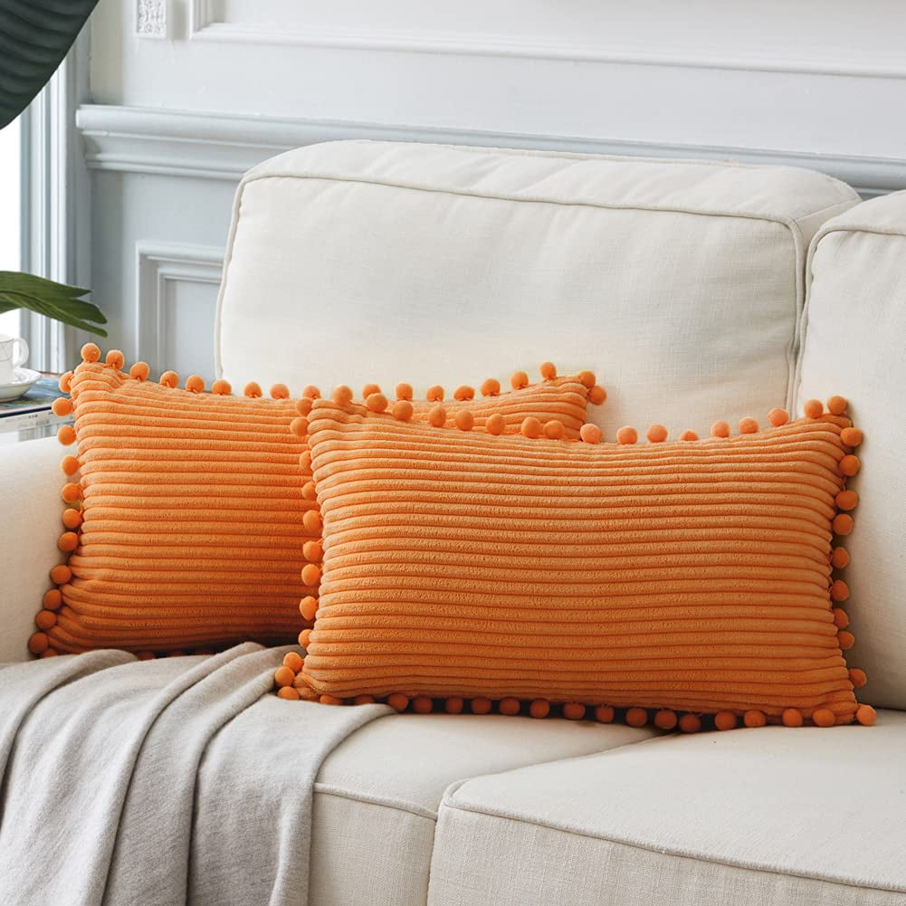 White pillows hotsell with pom poms