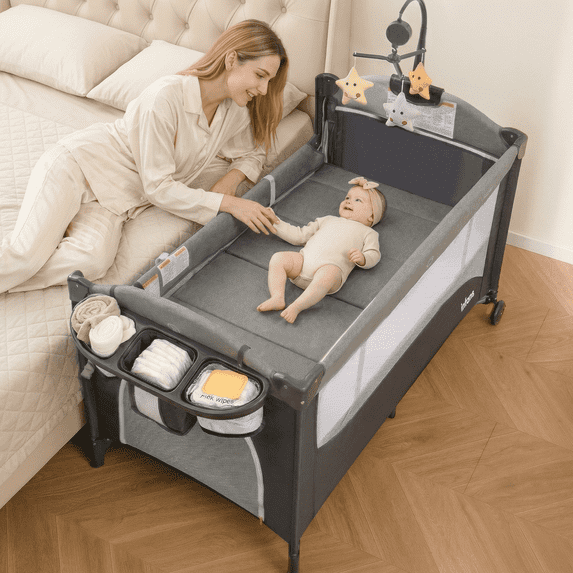 INFANS 5 in 1 Portable Playard, Larger Size Baby Bassinet Bedside Sleeper, Diaper Changer, Mattress, Carry Bag, Music Box & Hanging Toys, Foldable Bedside Crib for Newborn Toddlers