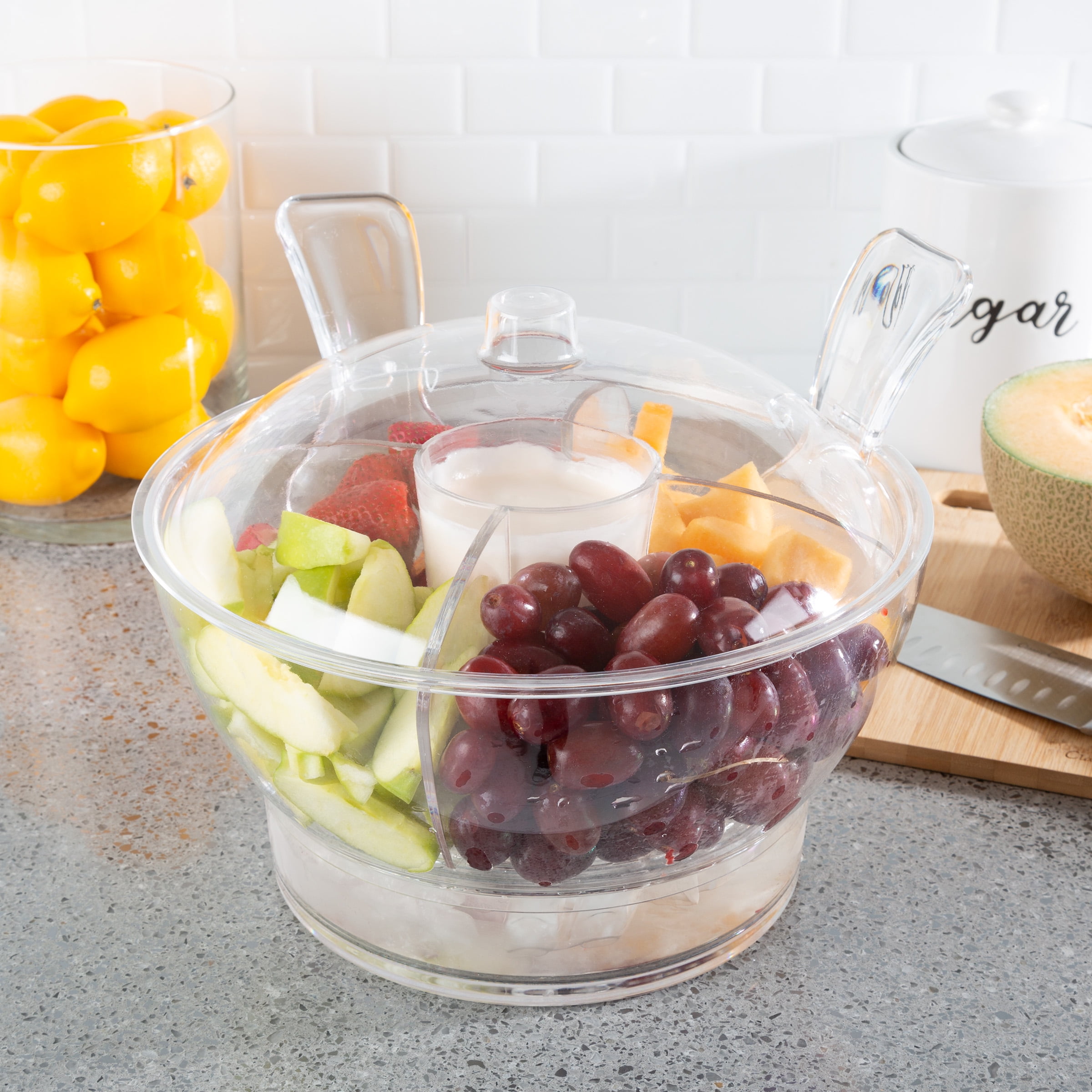 Serving bowl with ice clearance compartment