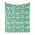 thumbnail image 1 of Ice Skates Soft Flannel Fleece Throw Blanket, Pattern of Goalkeeper Hockey Stick Snowflakes Sports Equipment, Cozy Plush for Indoor and Outdoor Use, 70" x 90", Peacock Green and White, by Ambesonne, 1 of 5