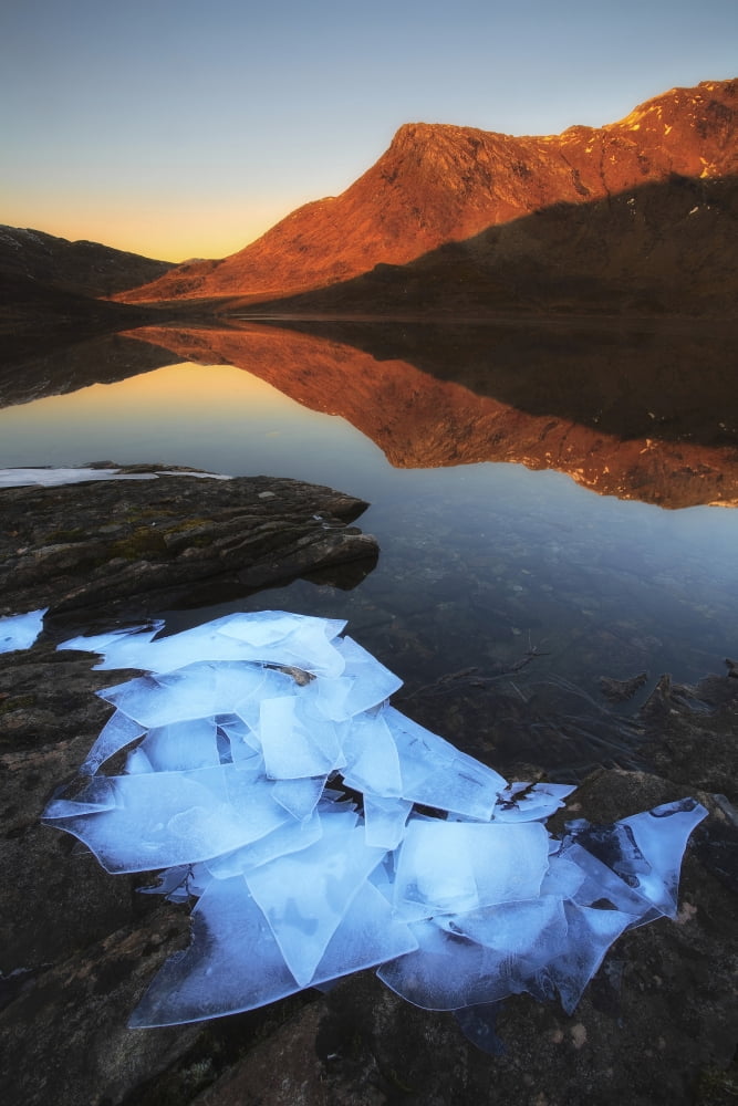 Ice flakes in the shadows of Skittendalen Valley in Troms County Norway Canvas Art - Arild HeitmannStocktrek Images (12 x 18)
